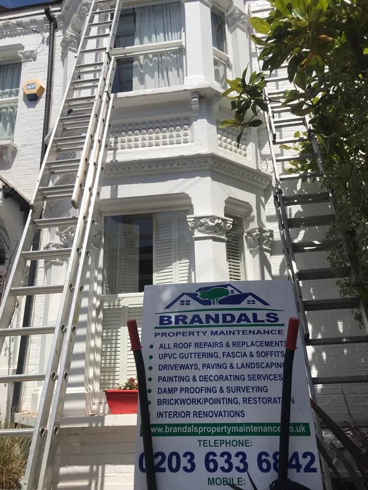 Freshly painted white rendered terrace completed by Brandals